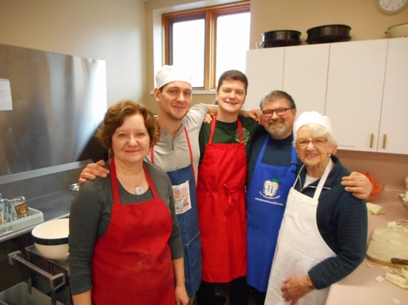 paul and family cooking hug