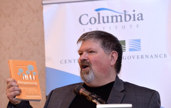 paul speaking with DC book held up